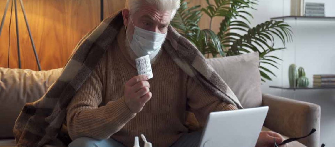 Elderly man getting online urgent care from a physician