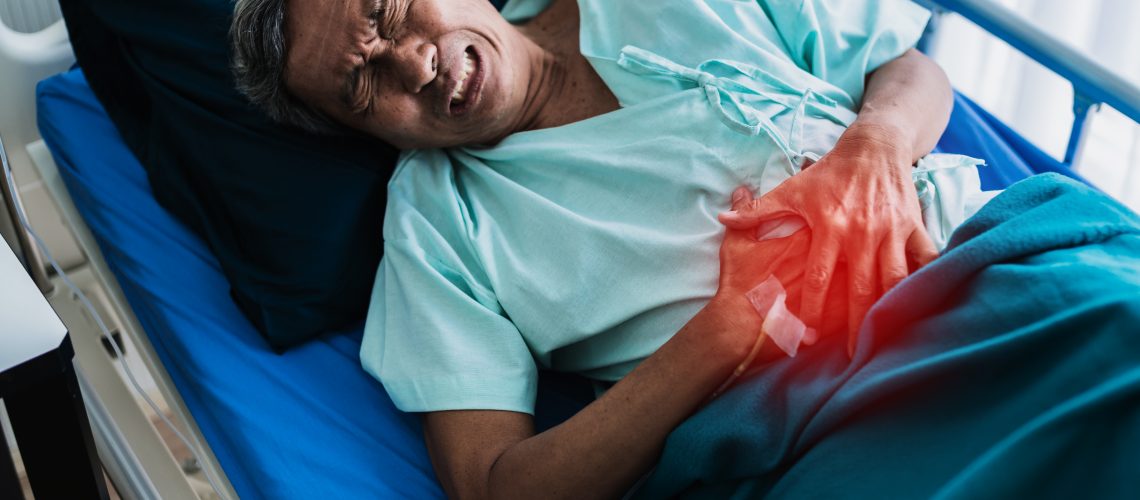 pain and stomache old senior asian grandfather in patient uniform suffer from body problem  health ideas concept